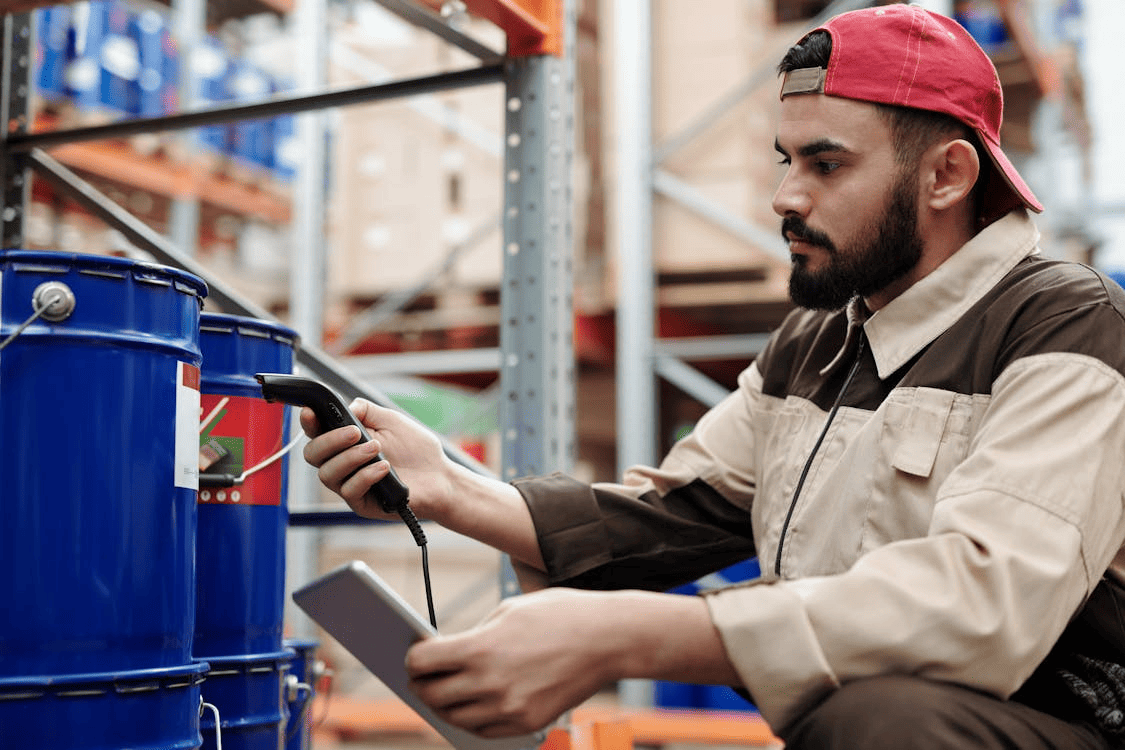 warehouse worker scanning container using modern technology revolutionizing logistics today