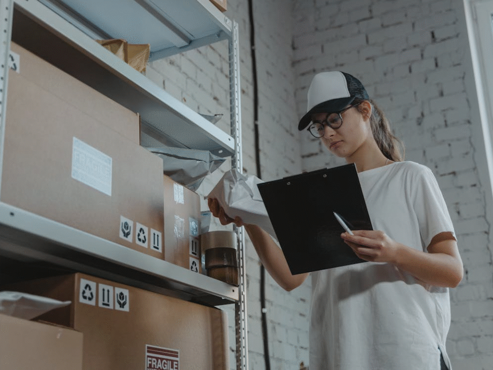 logistic worker checking paperwork symbolizing need for innovations in last-mile delivery